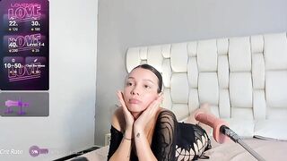 Emmelyx - Young girl sucks rubber cock and lies on the bed teasing in front of the camera