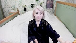 aminalive   Milf in a beautiful robe sits on the bed, chats sweetly and teases in front of the camera