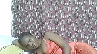 Pierra77 - Negro girl lies on the bed in a dress and does not want to undress