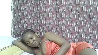 Pierra77 - Negro girl lies on the bed in a dress and does not want to undress