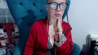 alexandra_zaryanova -A chick with glasses sweetly chatting and teasing in front of the camera.