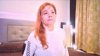 Mia_Peython - Red-haired milf in clothes teasing in front of the camera sweetly chatting