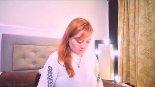 Mia_Peython - Red-haired milf in clothes teasing in front of the camera sweetly chatting