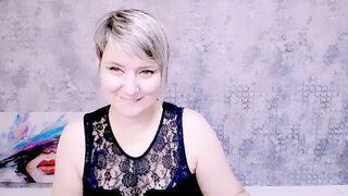 Djullia -  a mature maid smiles sweetly and chats in a chat room