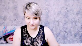 Djullia -  a mature maid smiles sweetly and chats in a chat room