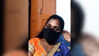 Hydcouple - Indian woman in a mask communicating on camera