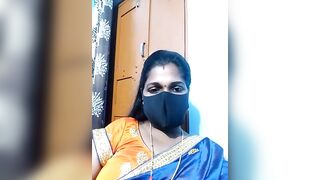 Hydcouple - Indian woman in a mask communicating on camera