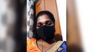 Hydcouple - Indian woman in a mask communicating on camera