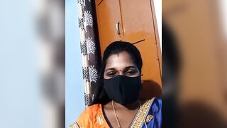 Hydcouple - Indian woman in a mask communicating on camera