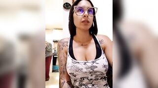 charlotte_stevenss_ - Tattooed babe sits chatting in front of the camera.