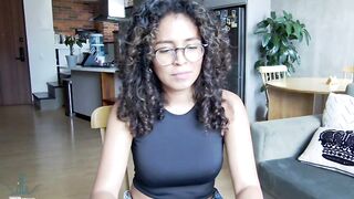 illaroom - Curly-haired babe sits chatting and hesitates to undress in front of the camera.