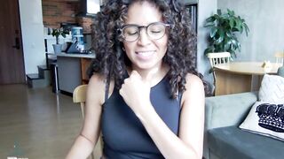 illaroom - Curly-haired babe sits chatting and hesitates to undress in front of the camera.