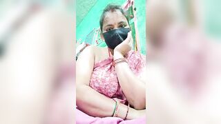 Savita__Bhabhi - Indian woman in clothes sits chatting and shy to undress in front of the camera