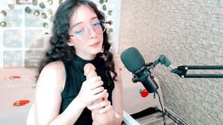 emma_unu -Curly-haired brunette in glasses sucks a rubber cock down her throat and imagines that it's real.