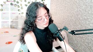 emma_unu -Curly-haired brunette in glasses sucks a rubber cock down her throat and imagines that it's real.