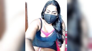 DISNI1997 - Cute Latina sitting in her clothes chatting.