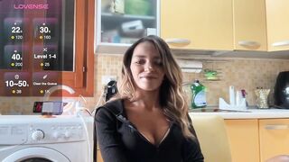 elisabettina02 - Young housewife having a nice chat in her kitchen.