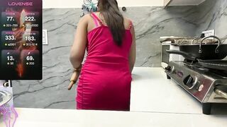 Sizzling__ZAARA -Housewife in a dress showing how she cooks.