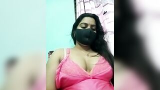 Amisha-2 - Indian girl in a negligee sits chatting with a chat room