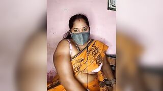 tamilvillagecouple1 -A fat Indian woman sits with her clothes on and is too shy to show herself naked.