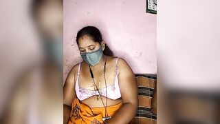 tamilvillagecouple1 -A fat Indian woman sits with her clothes on and is too shy to show herself naked.