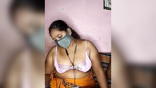 tamilvillagecouple1 -A fat Indian woman sits with her clothes on and is too shy to show herself naked.