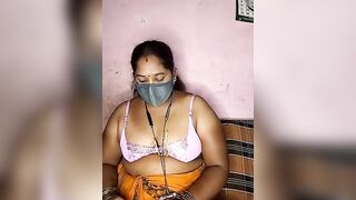 tamilvillagecouple1 -A fat Indian woman sits with her clothes on and is too shy to show herself naked.