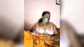 tamilvillagecouple1 -A fat Indian woman sits with her clothes on and is too shy to show herself naked.