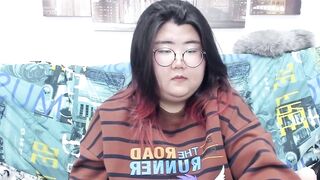 Nadine_asian - busty young woman with big tits sweetly chats and teases in front of the camera