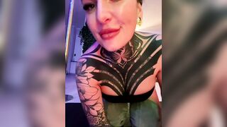 InkedBiitch - Brunette in tattoos sweetly chatting and sucking a rubber cock on camera