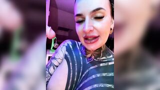 InkedBiitch - Brunette in tattoos sweetly chatting and sucking a rubber cock on camera