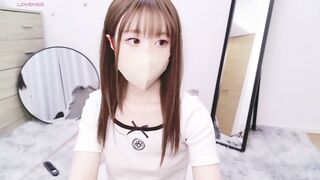 AI_JP - Young Asian girl sweetly chatting and teasing in front of the camera with her clothes on