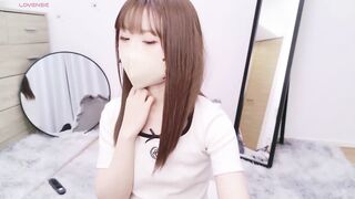 AI_JP - Young Asian girl sweetly chatting and teasing in front of the camera with her clothes on